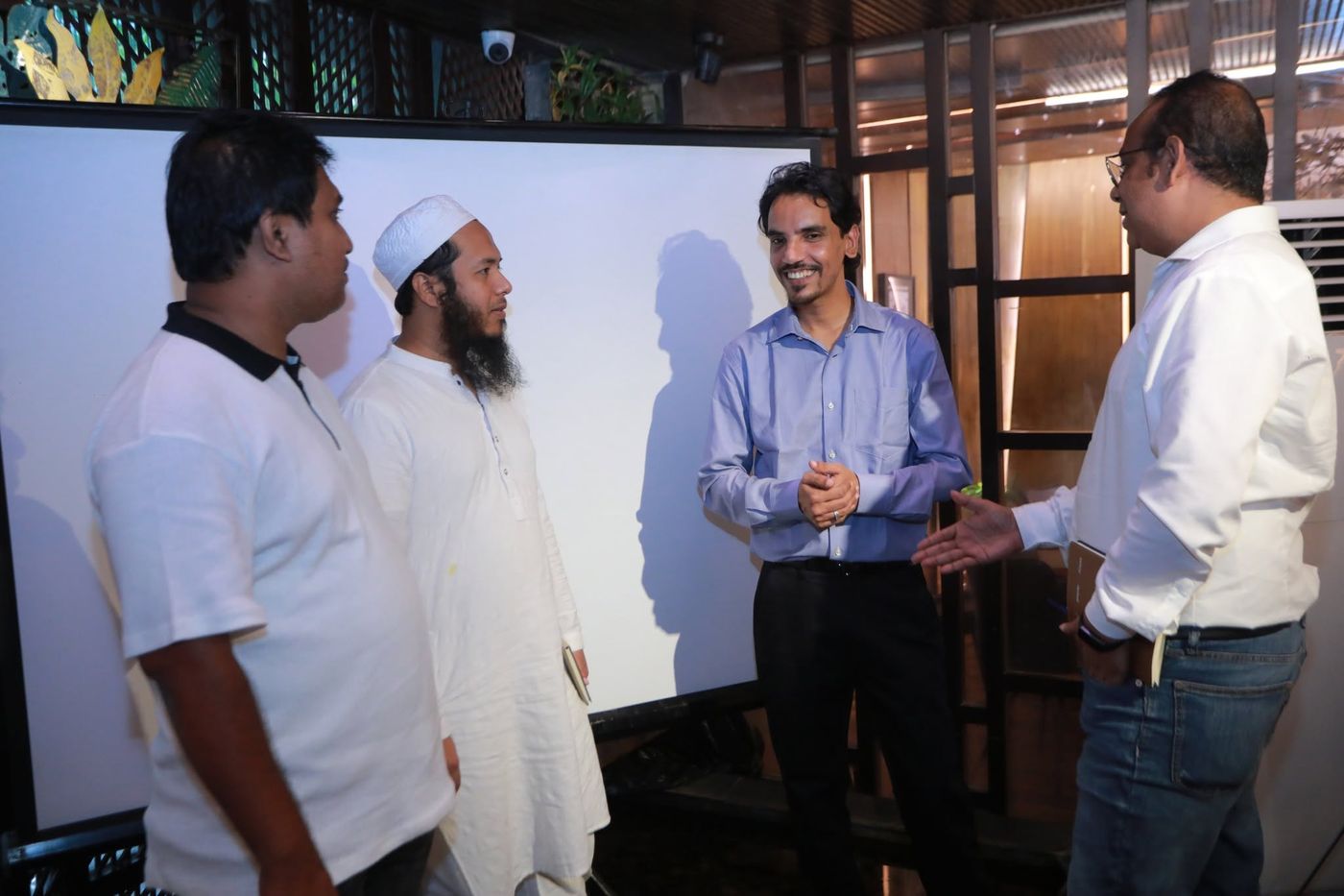J. Sarkar discussing with participants